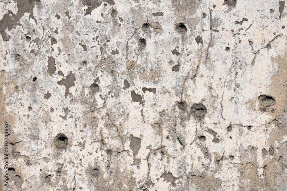 Concrete wall background with bullet holes Concrete wall background with bullet holes