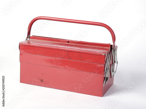 old dirty red box with tools on white background isolated