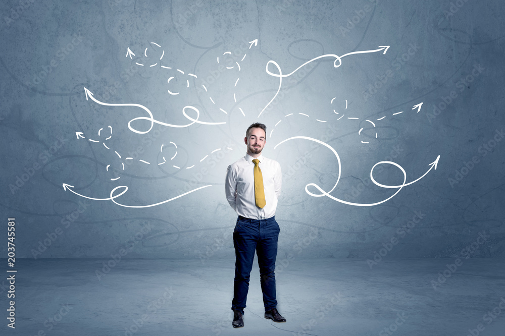 Elegant businessman choosing between directions with winding drawn arrows around
Elegant businessman choosing between directions with winding drawn arrows around