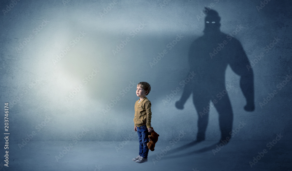 Cute kid in a room with plush on his hand and hero shadow on his background
Cute kid in a room with plush on his hand and hero shadow on his background