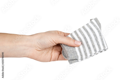 Cotton kid socks with hand, isolated on white background
