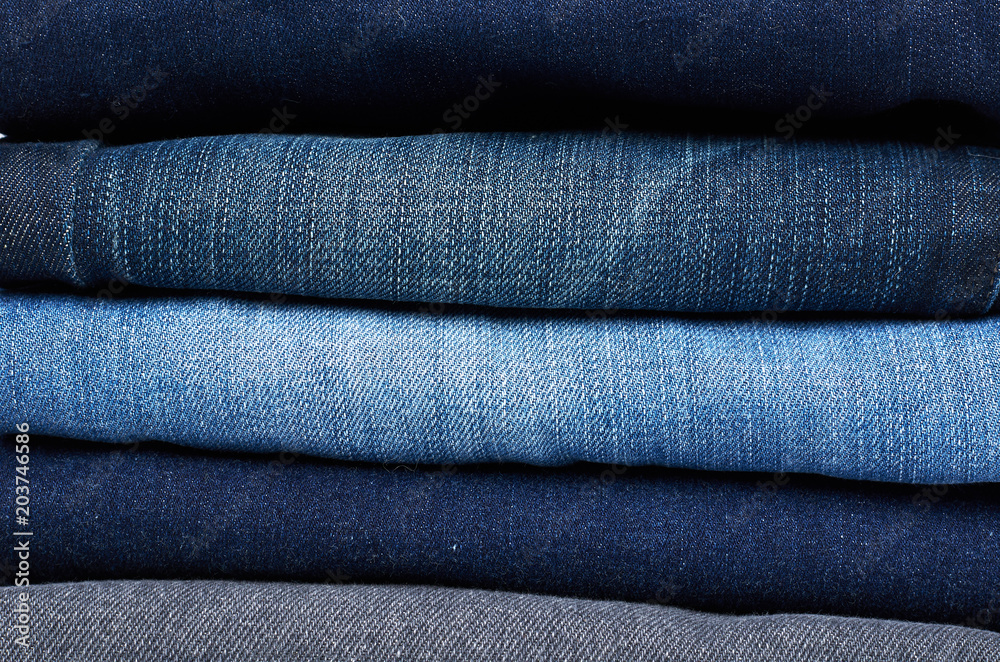Foldet jeans in pile background