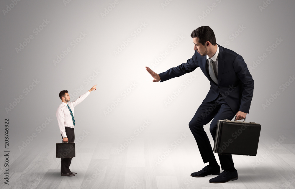 Small businessman in shirt pointing to an afraid businessman
Small businessman in shirt pointing to an afraid businessman