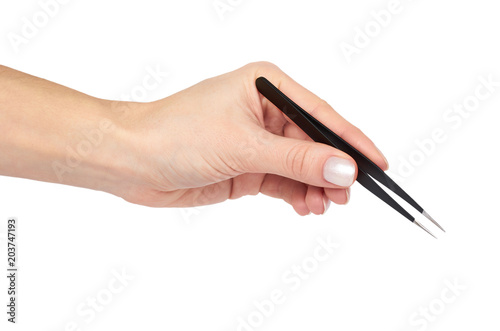 Black makeup tweezer with hand, isolated on white background