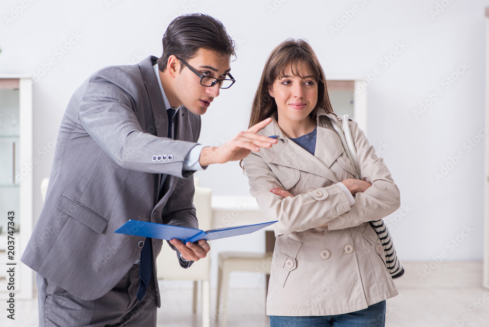 Real estate agent showing new apartment property to client Real estate agent showing new apartment property to client
