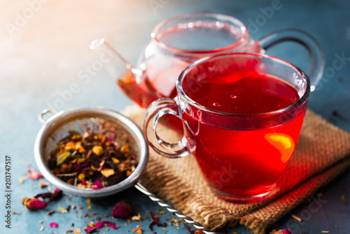 Process brewing tea,tea ceremony,Cup of freshly brewed fruit and herbal tea, dark mood.