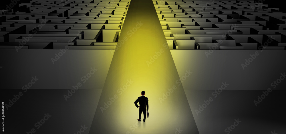 Businessman going straight ahead on a wide road between dark mazes
Businessman going straight ahead on a wide road between dark mazes