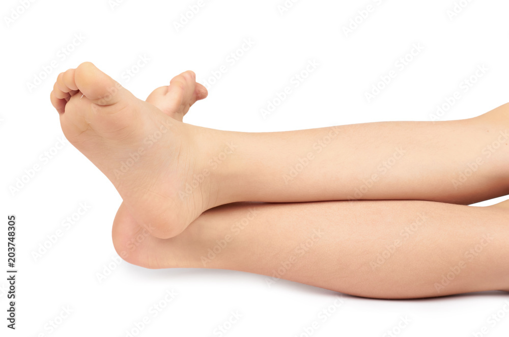 Cute kid leg, fast growing foot, isolated on white background