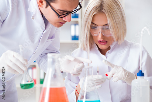 Two chemists having discussion in lab