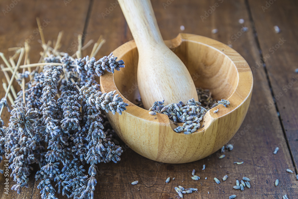 Bouquet of lavenders, wooden mortar and pestle Bouquet of lavenders, wooden mortar and pestle