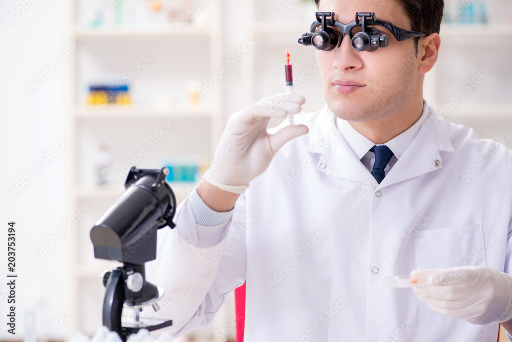 Doctor chemist working on blood samples in lab Doctor chemist working on blood samples in lab