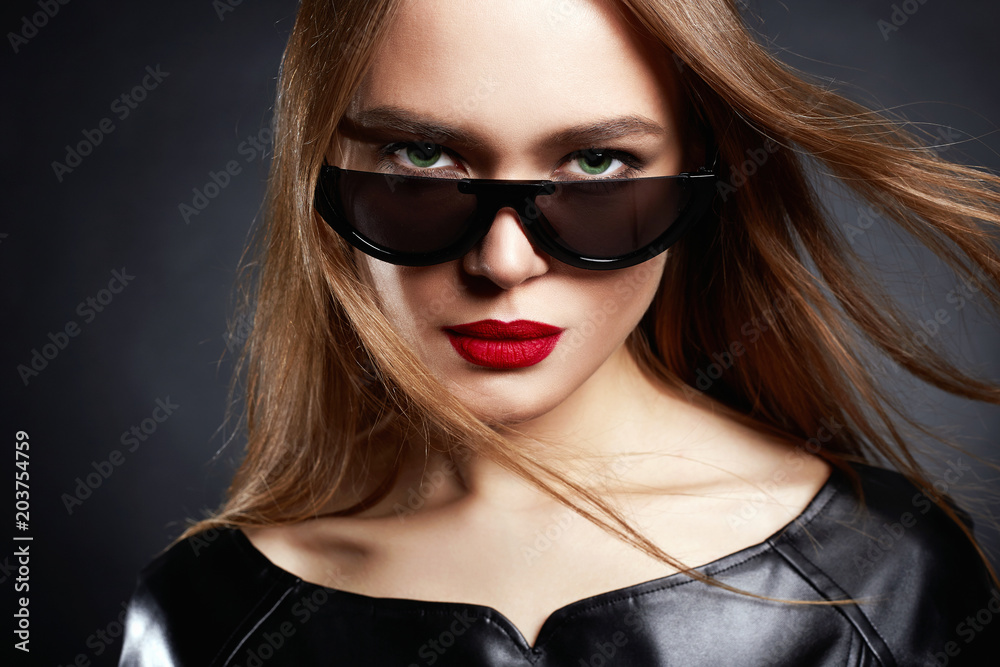 Beautiful Woman in Sunglasses and Leather Beautiful Woman in Sunglasses and Leather
