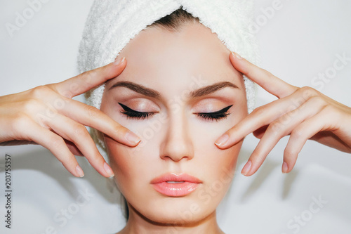 Beautiful natural woman after cosmetic procedures , facelift , facial massage , visit a beautician , massage lines 