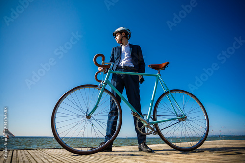 Young man standing with bike on pier © Jacek Chabraszewski