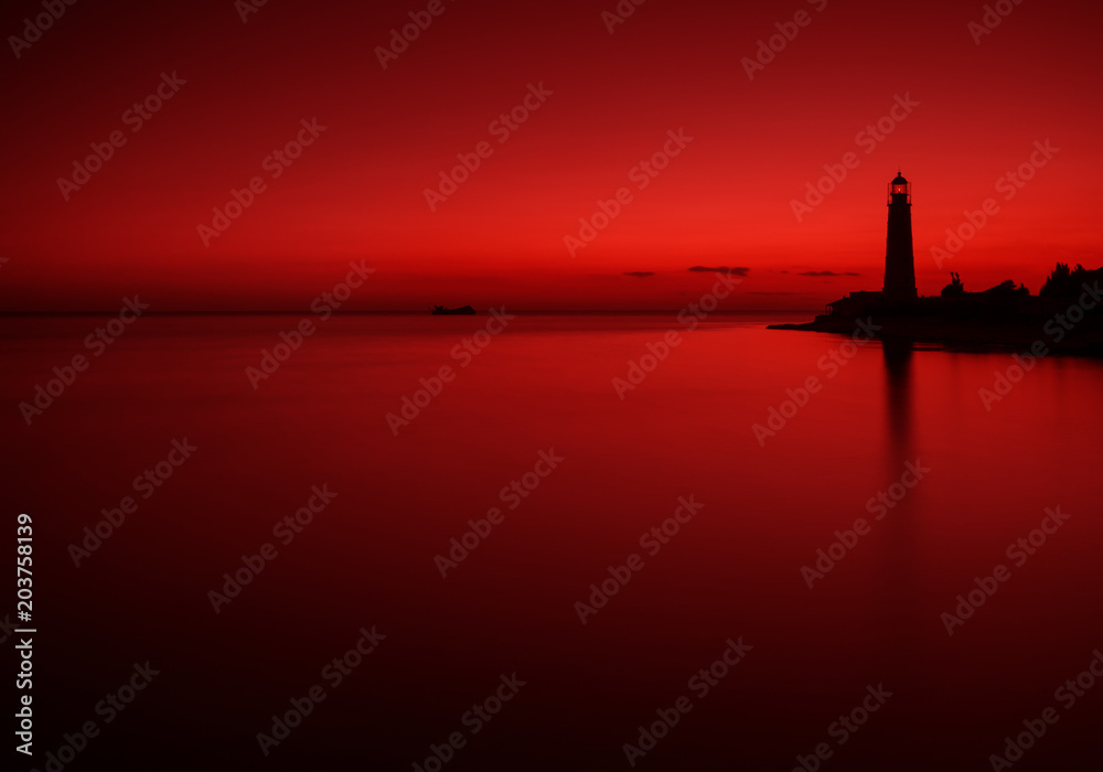 Sea Landscape In Dark Red Tones With The Silhouette Of A Sunken Ship And An Old Lighthouse. Seascape In Red Color. Artistic Scene Under The Name Bloody Mary: Sunken Tanker At Sunset Of The Day.