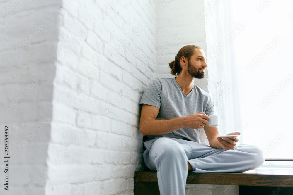 Man Drinking Coffee At Home In Morning. Man Drinking Coffee At Home In Morning.