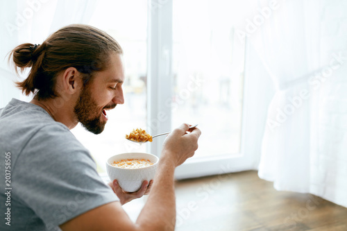 Man Having Healthy Breakfast At Home