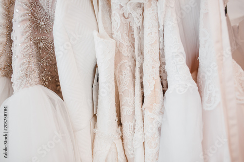 Billede på lærred White modern wedding dresses in gown store.