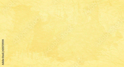 Yellow scratched background with spots of paint. photo