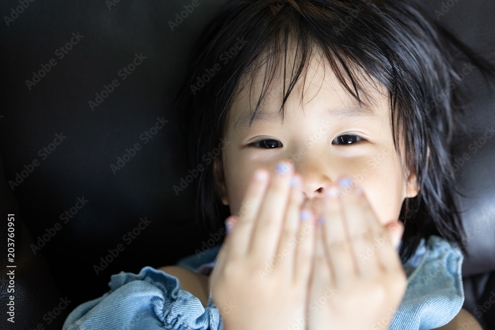 portrait of smiley eyes of asian little girl showing innocent and playful emotion portrait of smiley eyes of asian little girl showing innocent and playful emotion