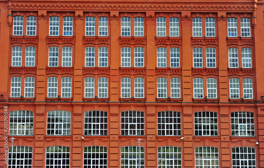 Windows of the red brick house in Moscow