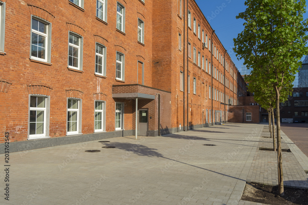 Office building of red brick in the yard of the old factory Office building of red brick in the yard of the old factory