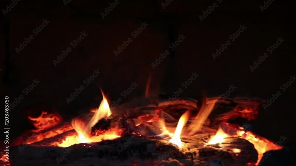 Hot coals and fire flames in fireplace, bonfire close-up. Hot coals and fire flames in fireplace, bonfire close-up.