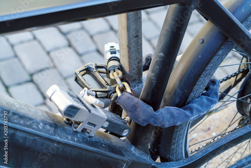 Electric bike, chained with several strong locks and chains