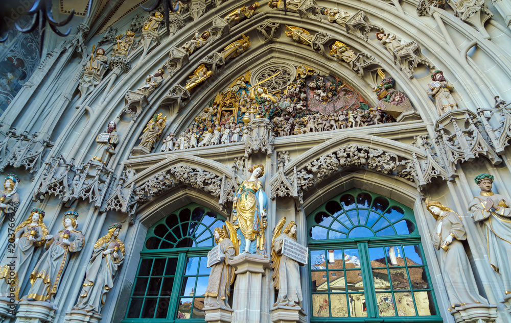 Main entrance of Minster cathedral with Last Judgement stone carving, Bern, Switzerland Main entrance of Minster cathedral with Last Judgement stone carving, Bern, Switzerland