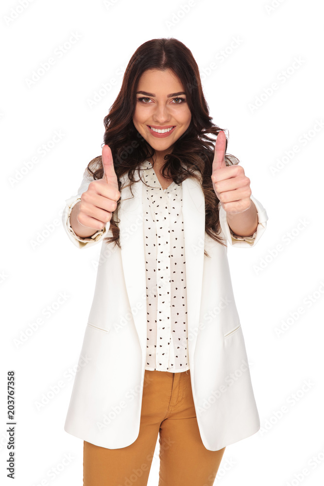 beautiful businesswoman making ok sign while smiling beautiful businesswoman making ok sign while smiling
