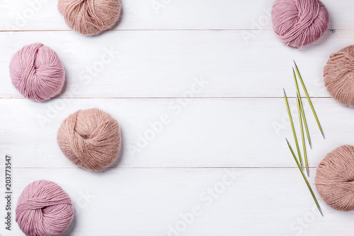 Wool skeins of thread on white boards. a ball of thread from the Italian angora. knitting