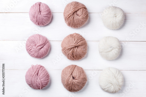 Wool skeins of thread on white boards. a ball of thread from the Italian angora. knitting