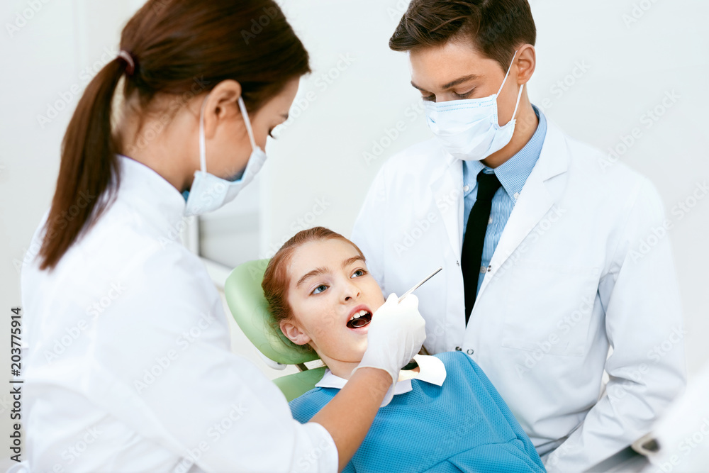 Oral Health Care. Dentist Doctors Making Examination Procedure Oral Health Care. Dentist Doctors Making Examination Procedure