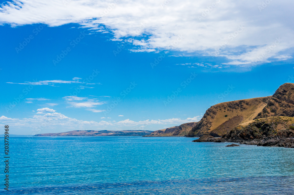 Mountain coastline with deep blue ocean water landscape Mountain coastline with deep blue ocean water landscape