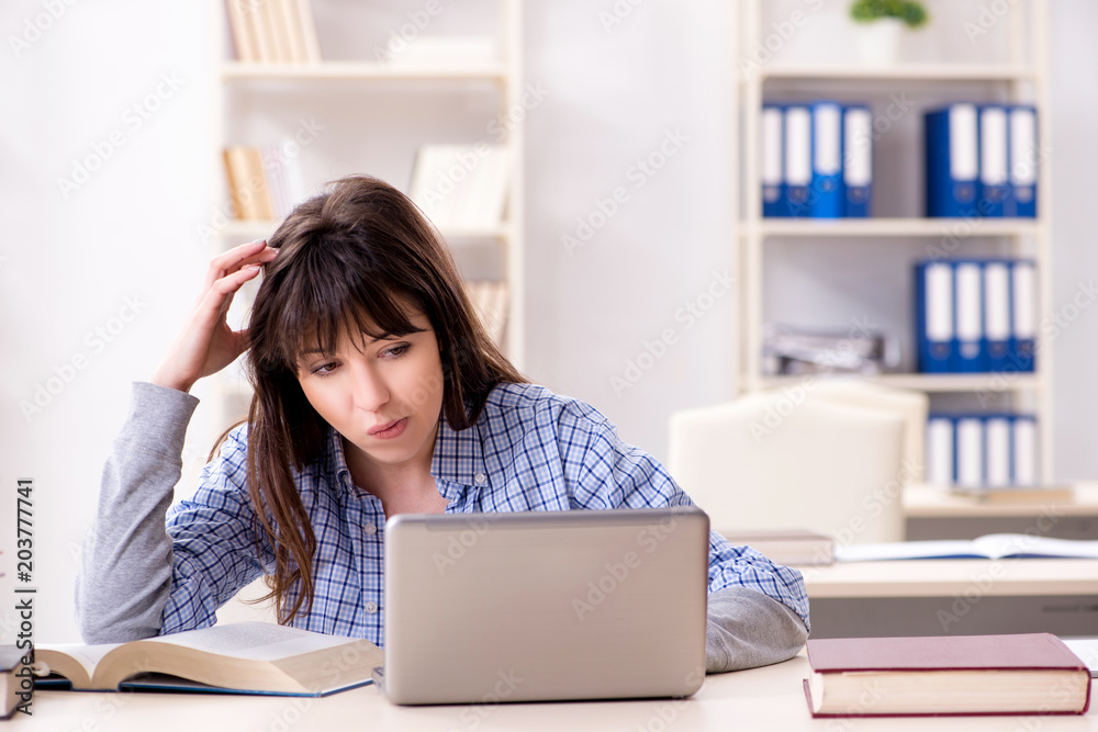 Young female student in educational concept Young female student in educational concept