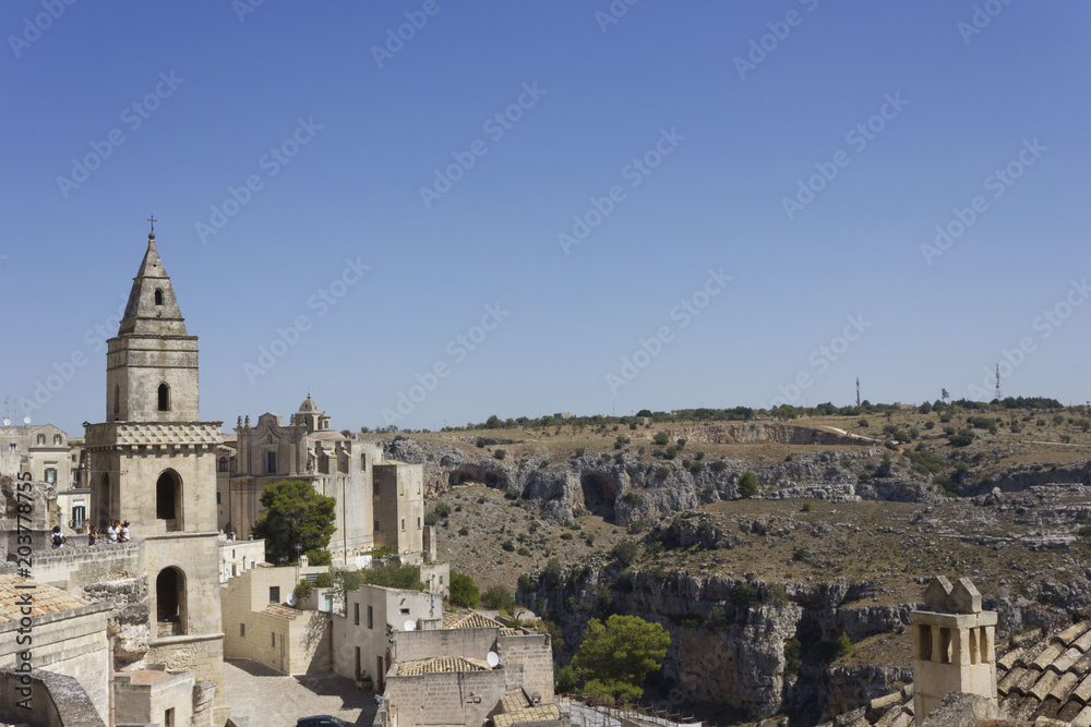 Ancient bell tower facing Matera landscape,Italy