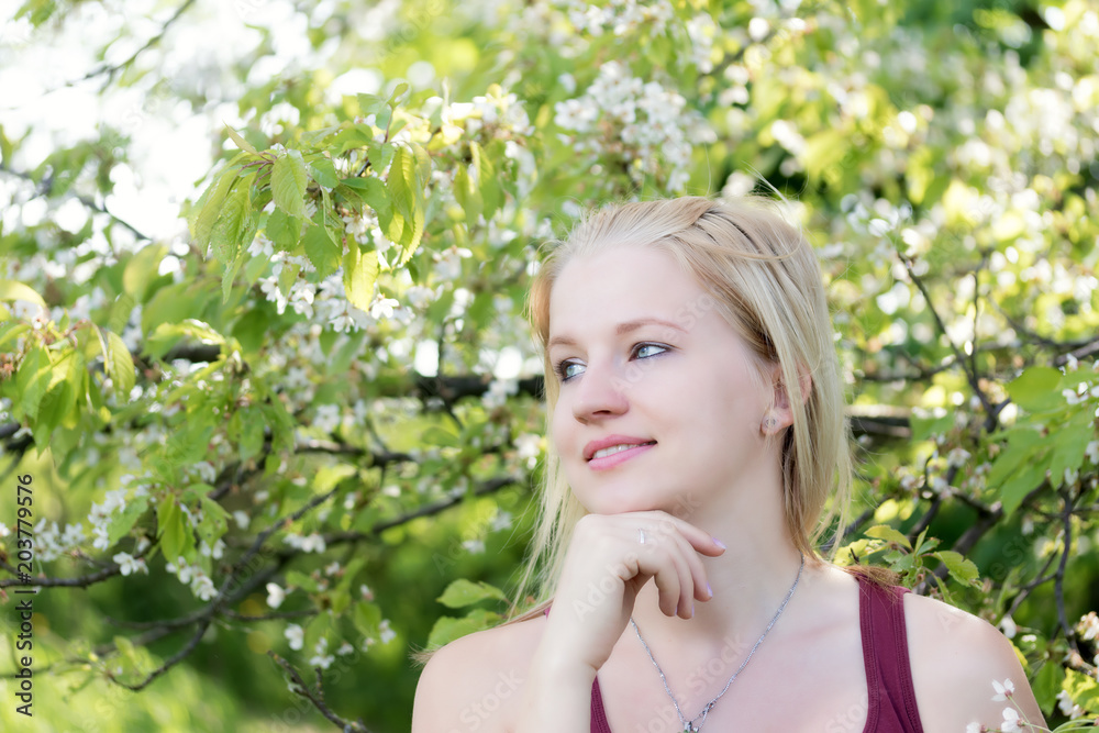 Portrait of cool smiling young blond woman looking at the side Portrait of cool smiling young blond woman looking at the side