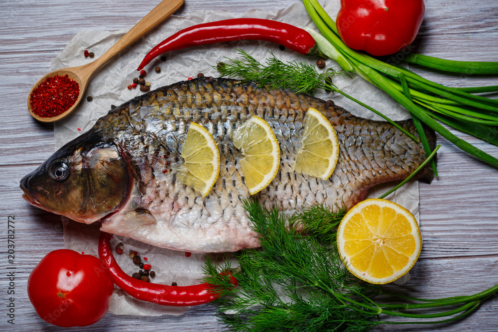Carp fish with fresh vegetables Carp fish with fresh vegetables