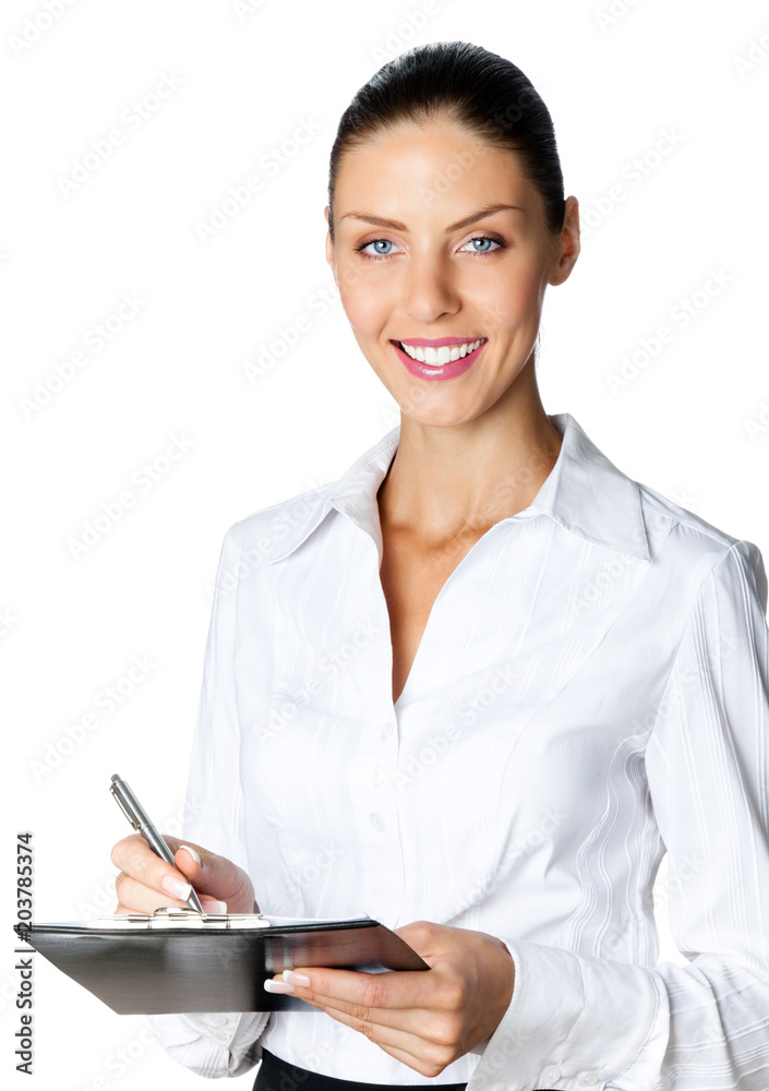 Cheerful beautiful business woman with clipboard writing, isolated over white