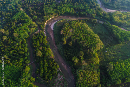 Bird eye view of river and deep rain forest in morning