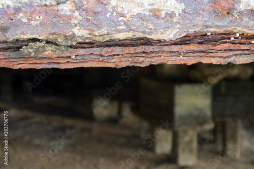 rust and erosion of concrete construction building on beach was damage by storm surge