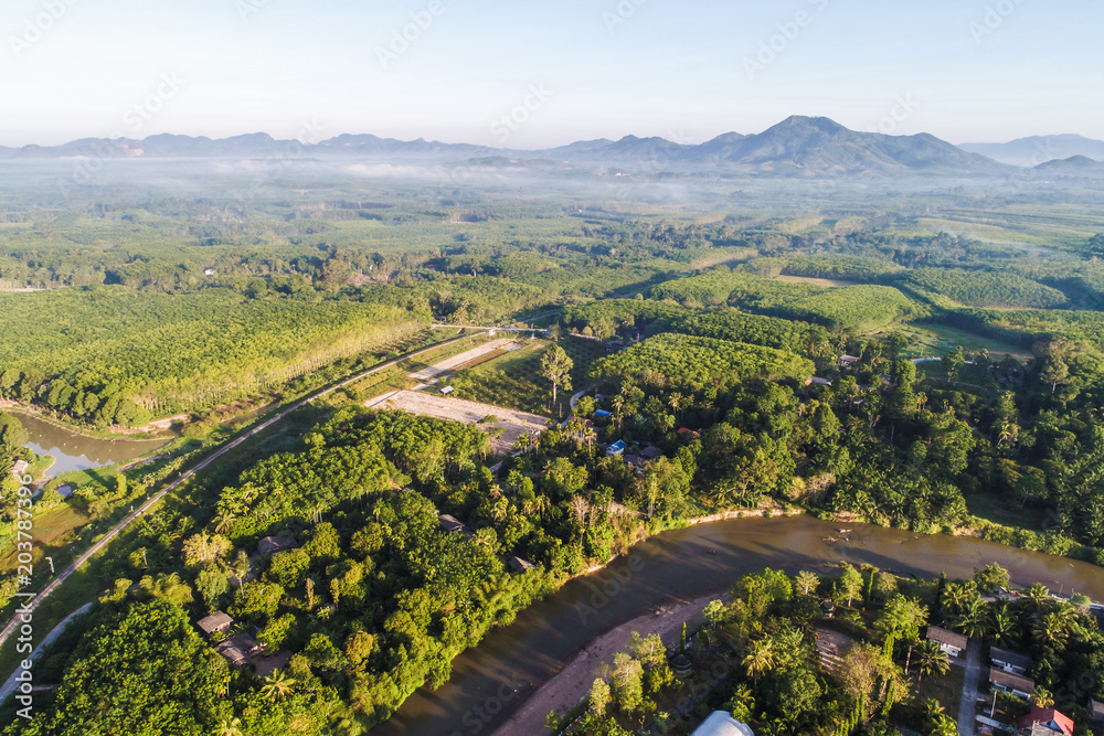 Obraz premium Aerial view rural village with river green tree in morning