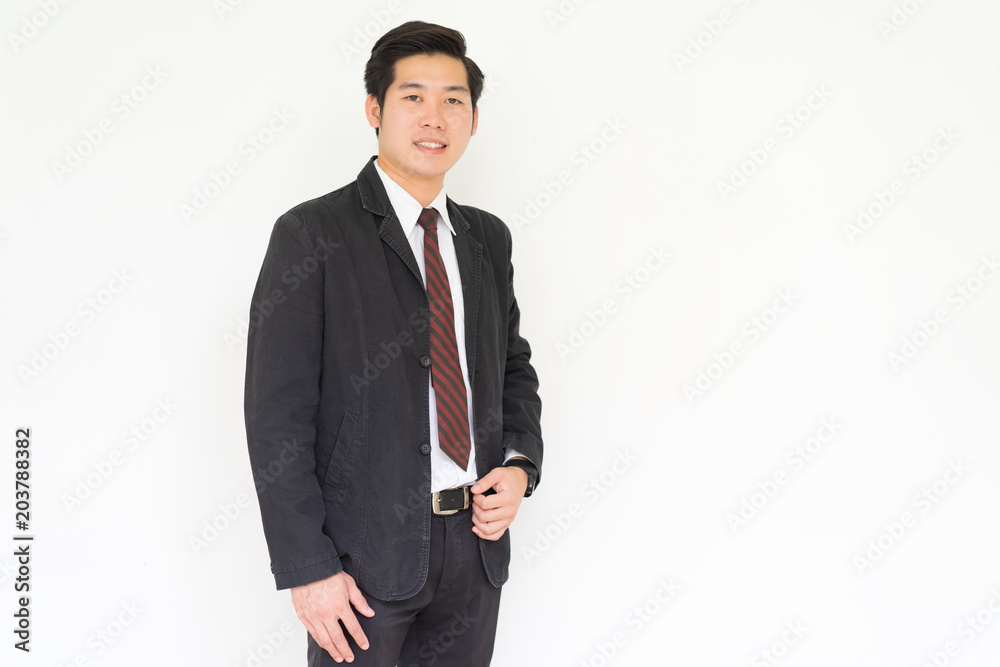 Happy asian young handsome businessman isolated over white background. Happy asian young handsome businessman isolated over white background.