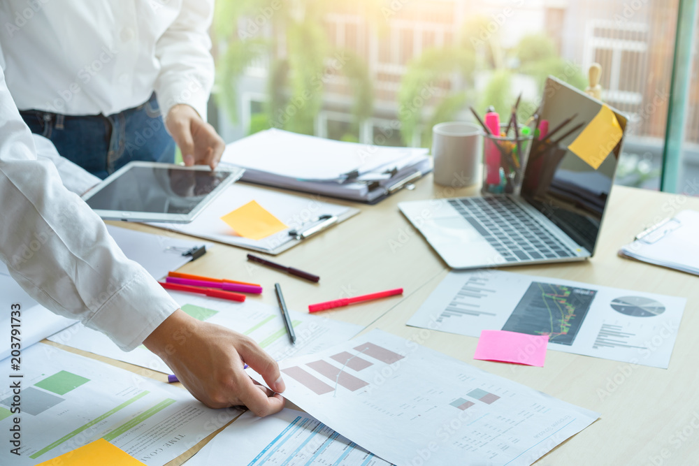 Young business teamwork working with business report document on office desk.Brainstorming Planning Partnership. Young business teamwork working with business report document on office desk.Brainstorming Planning Partnership.