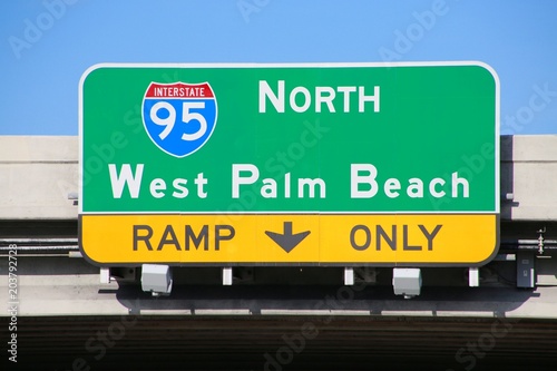 Fototapeta Naklejka Na Ścianę i Meble -  I-95 North West Palm Beach Ramp Only Sign on Overpass in Afternoon Sun