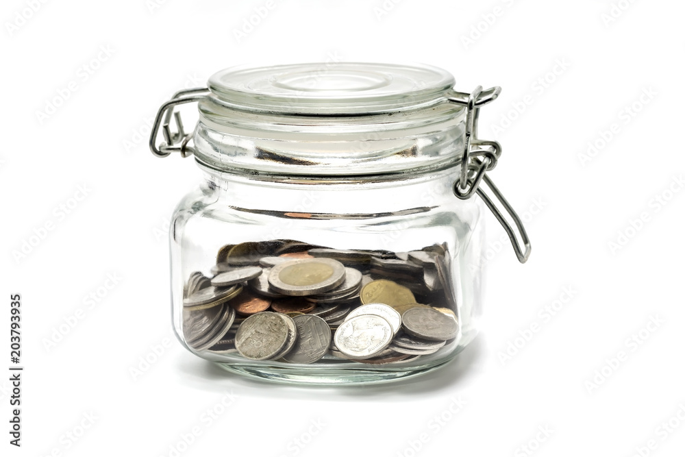Coins in glass bottle on white background, investment and saving concept Coins in glass bottle on white background, investment and saving concept