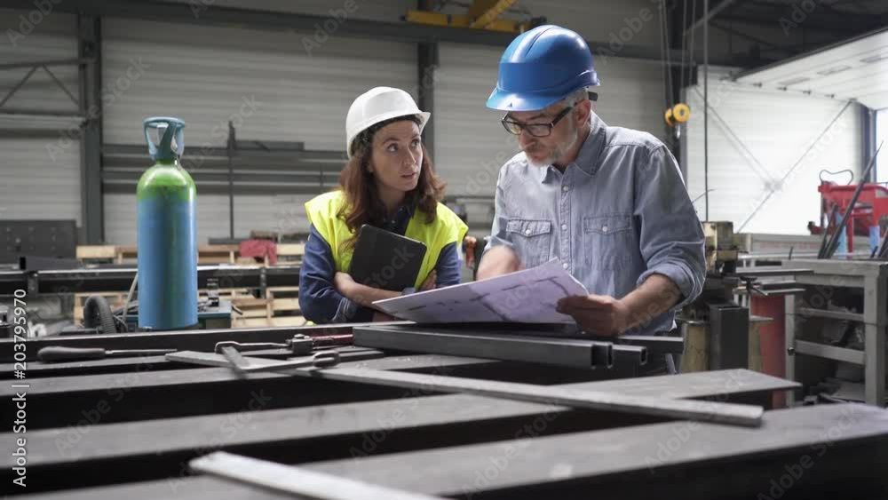 Metal industry manager and engineer meeting in factory