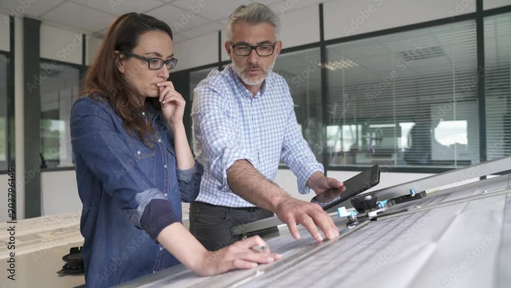 Industrial designers working together on project in office Industrial designers working together on project in office
