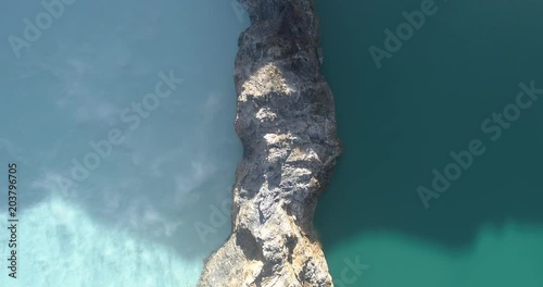 Kelimutu tri coloured volcano crater covered with mist an aerial view early morning, Indonesia