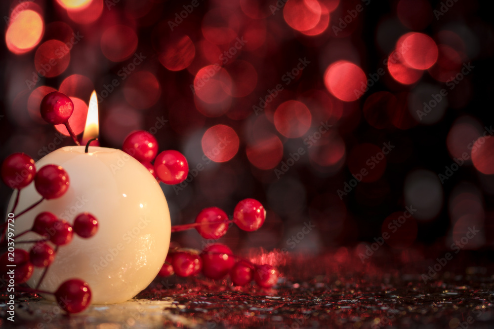 Christmas decoration with a round candle and red background